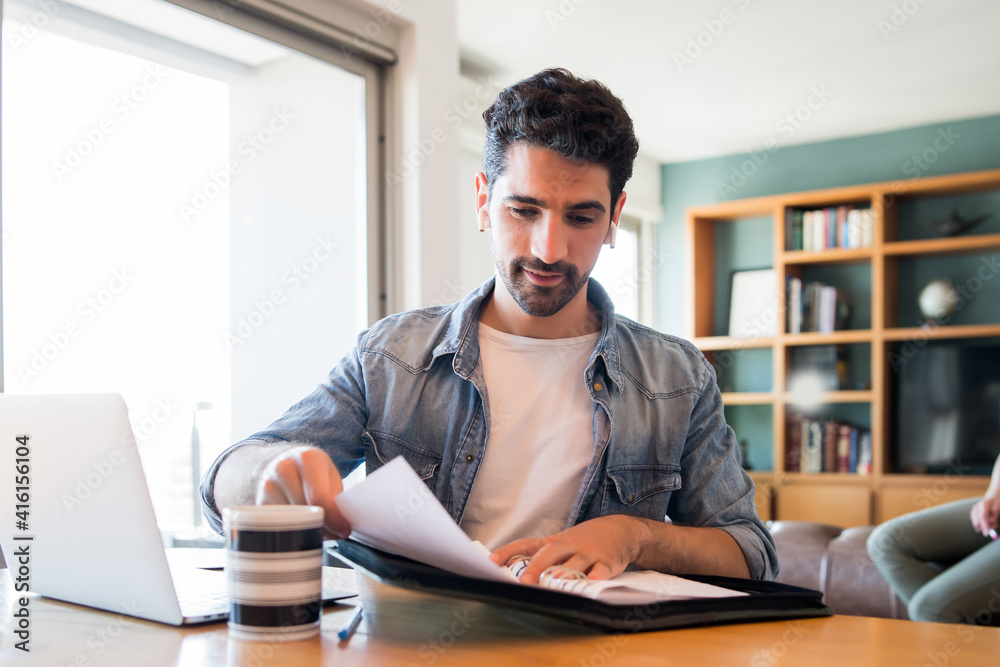 Business man working with laptop from home. Business man working with laptop from home.