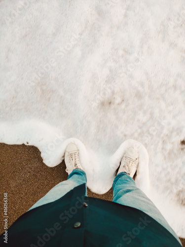 Standing by the sea shore