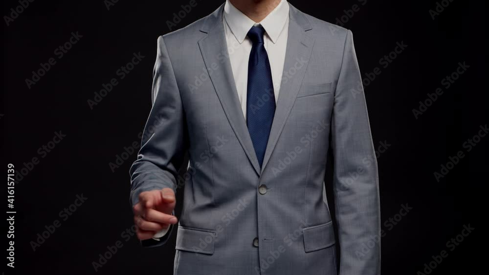 Studio portrait of successful and smart businessman in suit and tie. Man in formal wear over black background. Studio portrait of successful and smart businessman in suit and tie. Man in formal wear over black background.