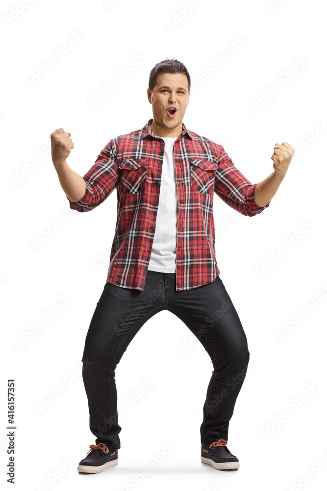Full length portrait of a happy young man cheering Full length portrait of a happy young man cheering