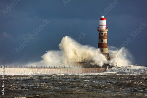 Image of a Lighthouse during a storm at Sunderland, Tyne and Wear, England, UK.