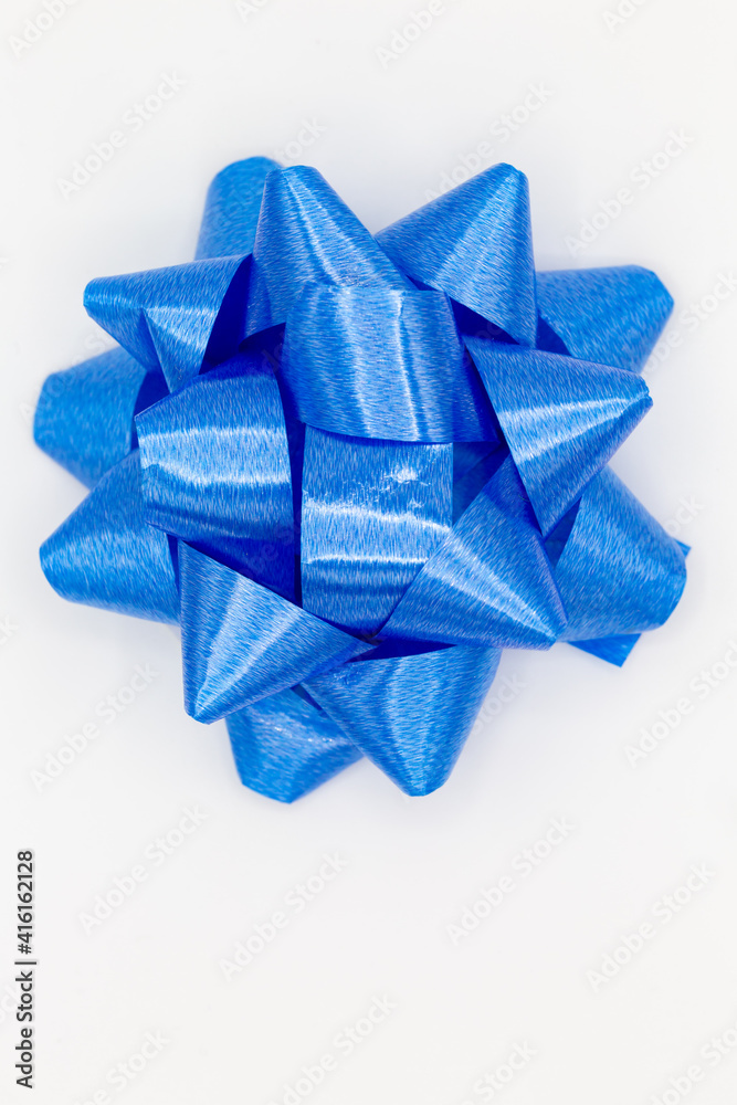 Blue bow on white background for birthdays, family celebrations, gifts or other celebrations as decoration Blue bow on white background for birthdays, family celebrations, gifts or other celebrations as decoration