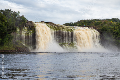 View of Waterfall Ax (Salto Hacha) falling on the lagoon in Canaima National Park (Venezuela).