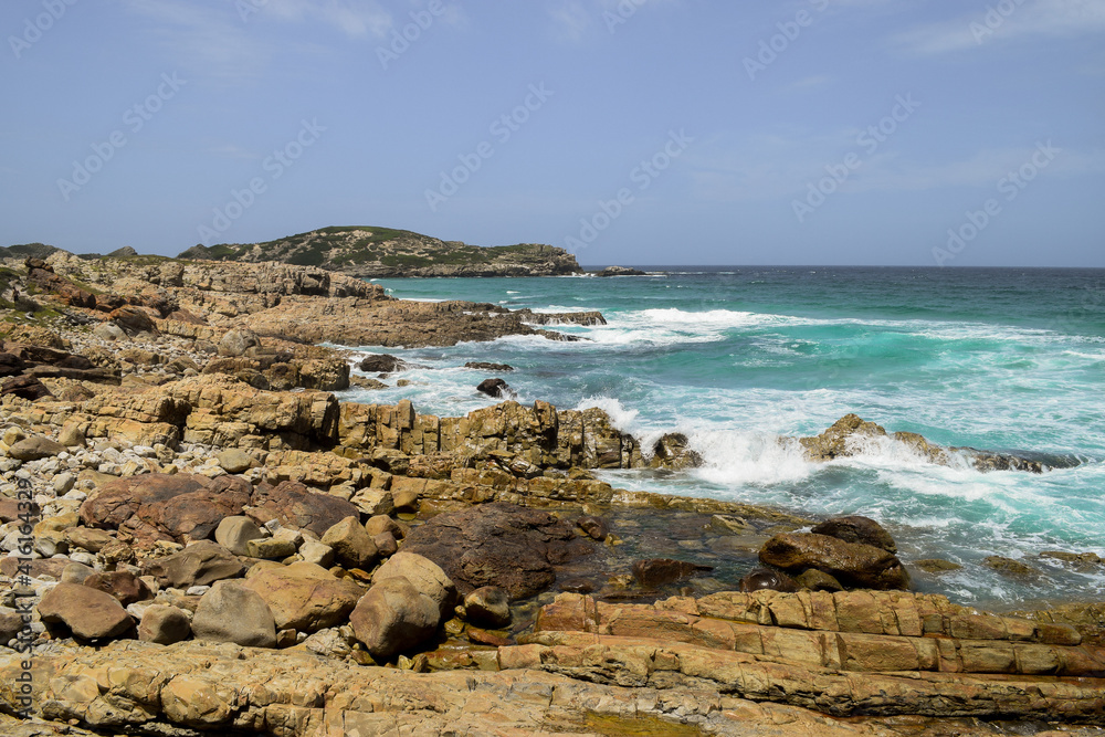 Small waves hitting the rocks in Robberg Nature Reserve, Plettenberg Bay, South Africa.