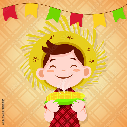 Boy eating boiled corn in junina party