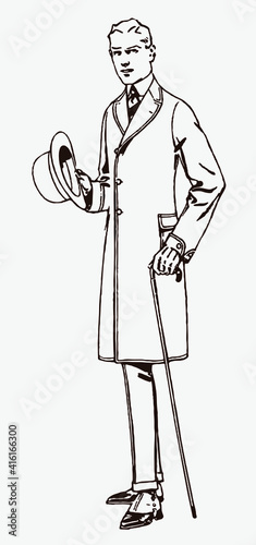Young man from the early 20th century wearing an overcoat and holding a hat and a walking stick