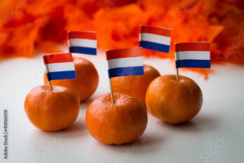 Oranges with Dutch flag and funny eye glasses on white background. Celebration of Dutch traditional king's day - Koningsdag. 27 april.