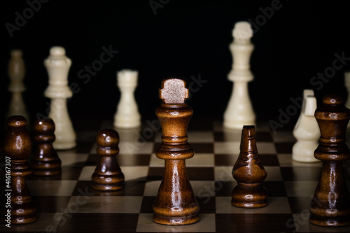 Wooden chess board and pieces.