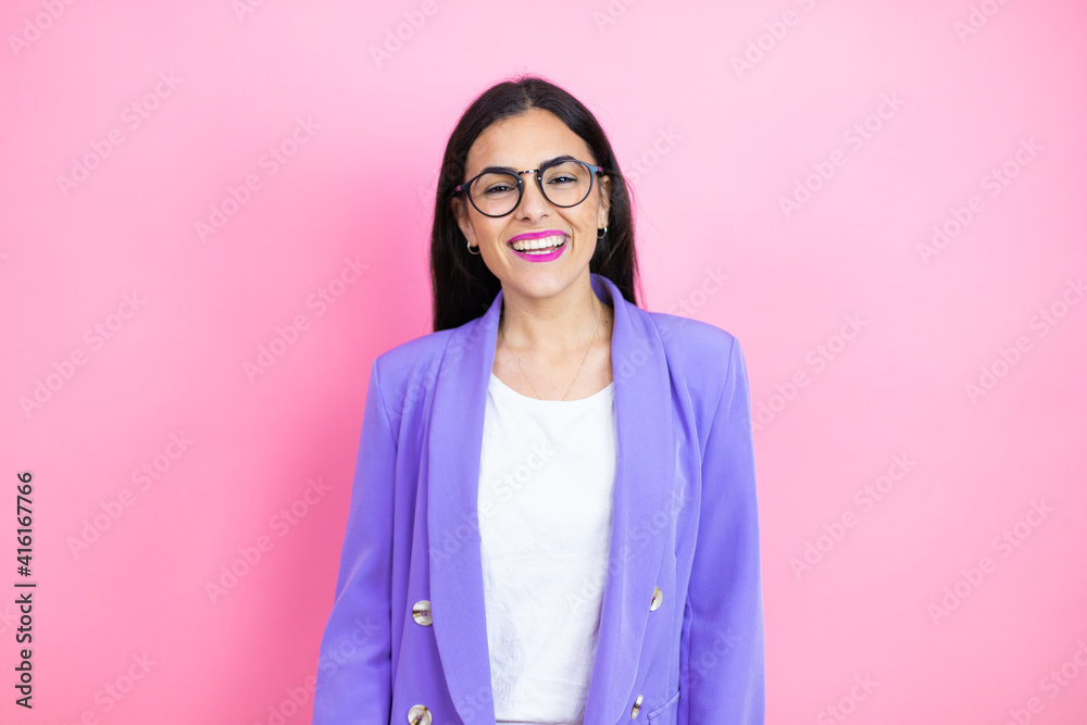 Φωτογραφία Young business woman wearing purple jacket over pink background with a happy fac