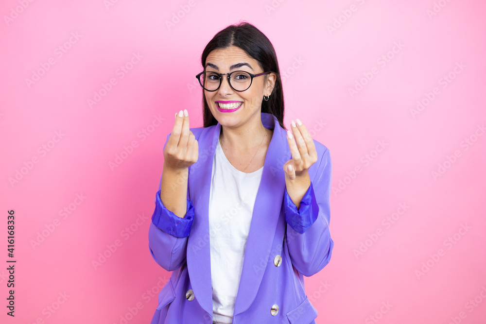 Young business woman wearing purple jacket over pink background depressed and worry for distress, crying angry and afraid. Sad expression.