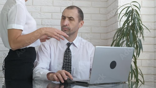 love affair in the office. A businessman keeps a distance in communication with a secretary in the office.