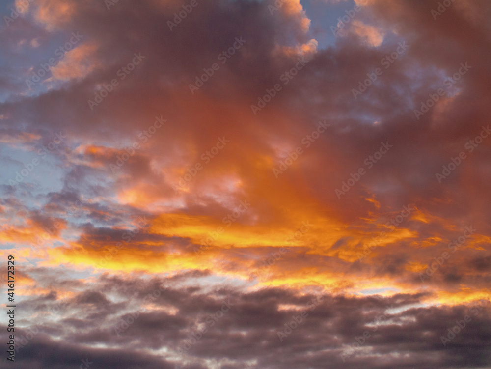 Beautiful dramatic sunset sky. Rich orange color. Nature background