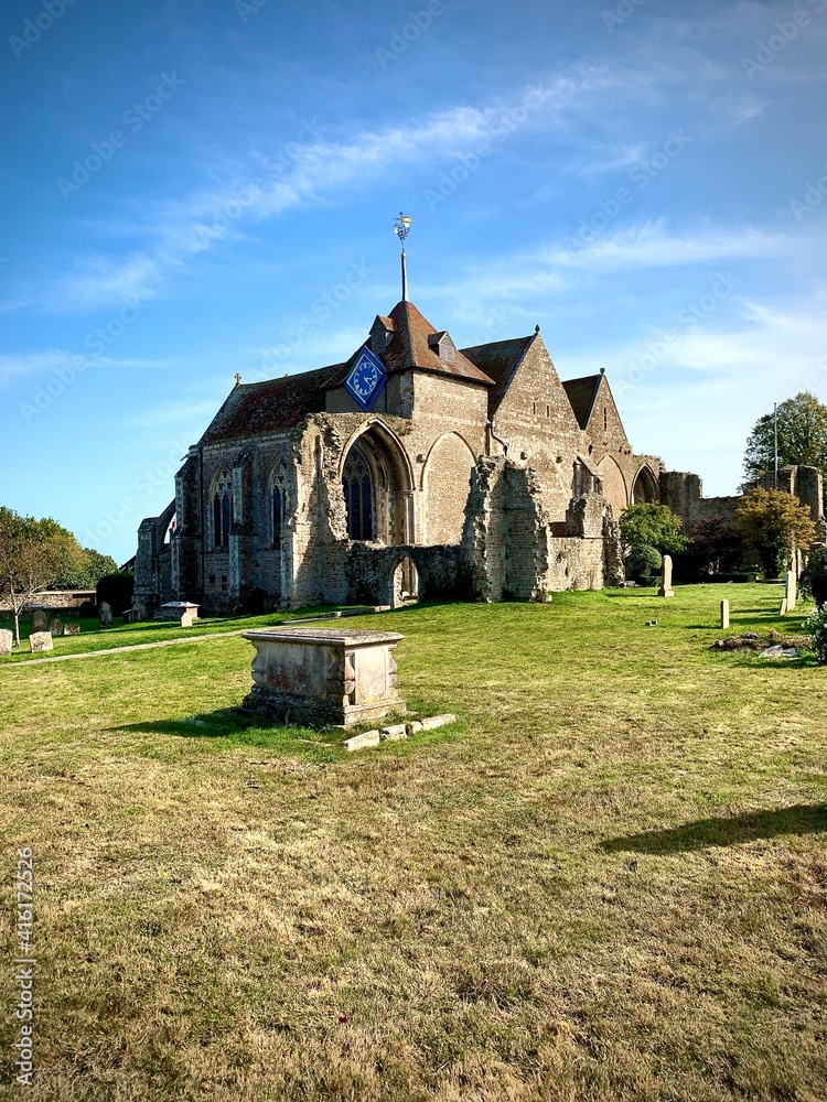 Afternoon View of the Ancient 13th Century St Thomas the Martyr Parish Church With Gravestones, Trees, and Lawn, Winchelsea, England 