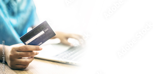 Hand holding a credit card, Payment for Shopping online.