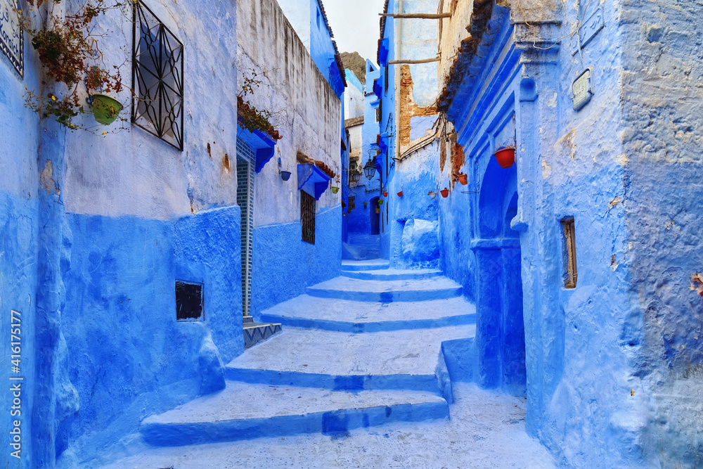 View of the blue walls of Medina quarter in Chefchaouen, Morocco. The city, also known as Chaouen is noted for its buildings in shades of blue and that makes Chefchaouen very attractive to visitors. View of the blue walls of Medina quarter in Chefchaouen, Morocco. The city, also known as Chaouen is noted for its buildings in shades of blue and that makes Chefchaouen very attractive to visitors.