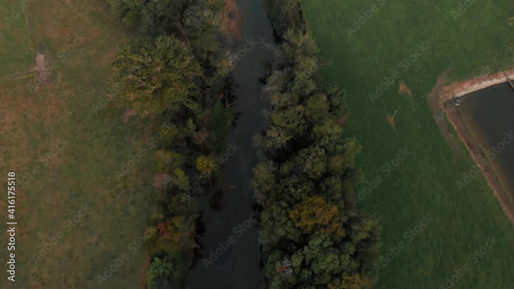 Canal waters running across countryside. Drone pov backward Canal waters running across countryside. Drone pov backward