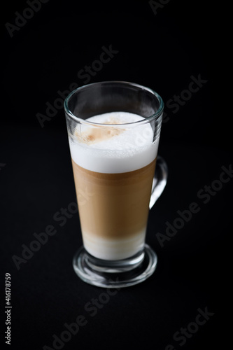  Coffee with milk on dark background. Copy space.