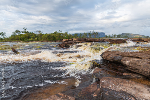 View of waterfalls falling on the lagoon in Canaima National Park (Venezuela).