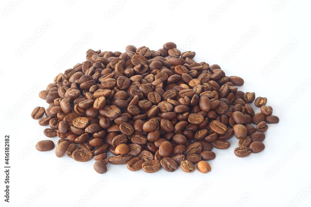 A pile of coffee beans isolated on white background. Roasted arabica coffee beans. A pile of coffee beans isolated on white background. Roasted arabica coffee beans.