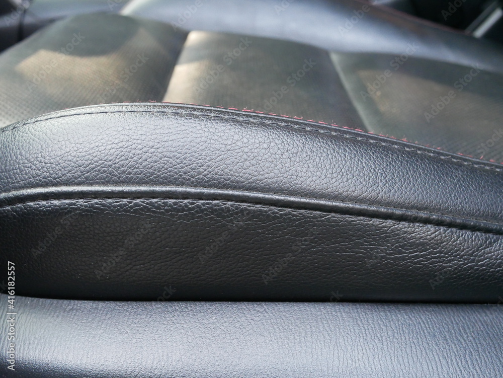 closeup of leather car seat texture background.
closeup of leather car seat texture background.