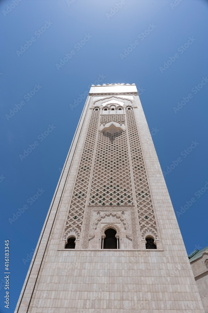 Obraz premium low angle view of the minaret of hassan ii mosque in casablanca