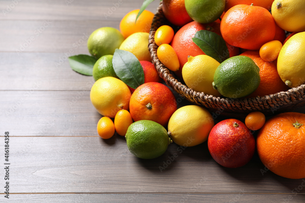 Different ripe citrus fruits on wooden table Different ripe citrus fruits on wooden table