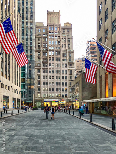 Fotografie American Flag flying in Rockefeller Plaza in Manhattan New York