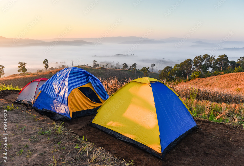Landscape sunrise beautiful in winter view outdoor travel camping tent area on mountain, tourist tent camping with fog mist