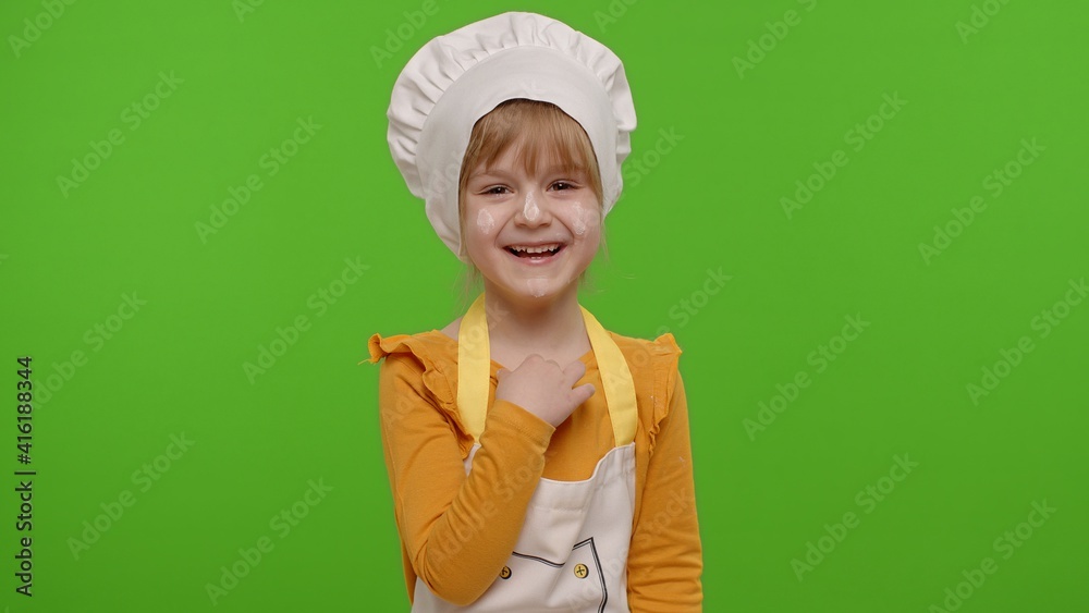 Child girl dressed cook chef baker in apron and hat laughing out loud after hearing funny joke, feeling positive carefree amused isolated on chroma key background. Cooking school, children education Child girl dressed cook chef baker in apron and hat laughing out loud after hearing funny joke, feeling positive carefree amused isolated on chroma key background. Cooking school, children education