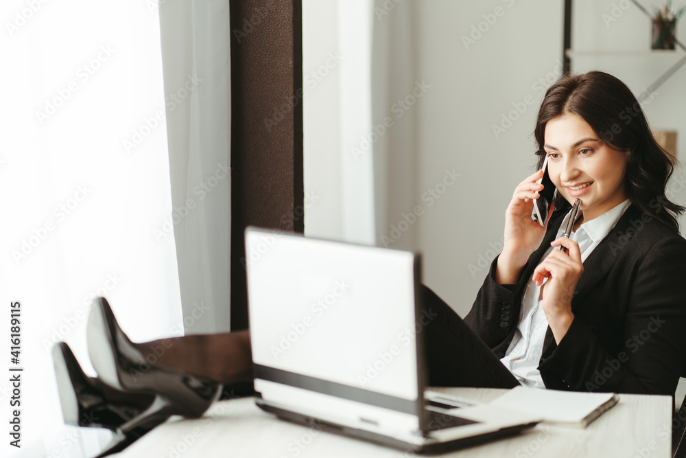 Woman working in home office using smart phone Woman working in home office using smart phone