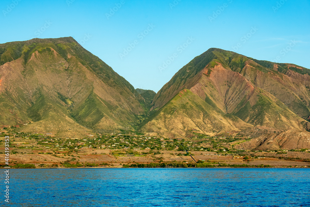 Beautiful view from ocean of Lahaina and West Maui mountains in Hawaii.