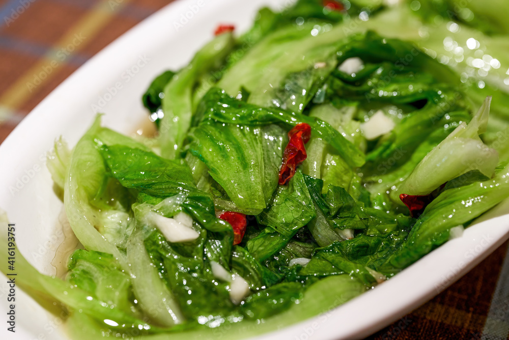 A dish of Chinese national dish, stir-fried lettuce with garlic and chili A dish of Chinese national dish, stir-fried lettuce with garlic and chili