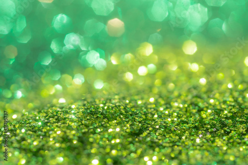 Spring sparkle background. Green colorful sparkles. Abstract advertising.