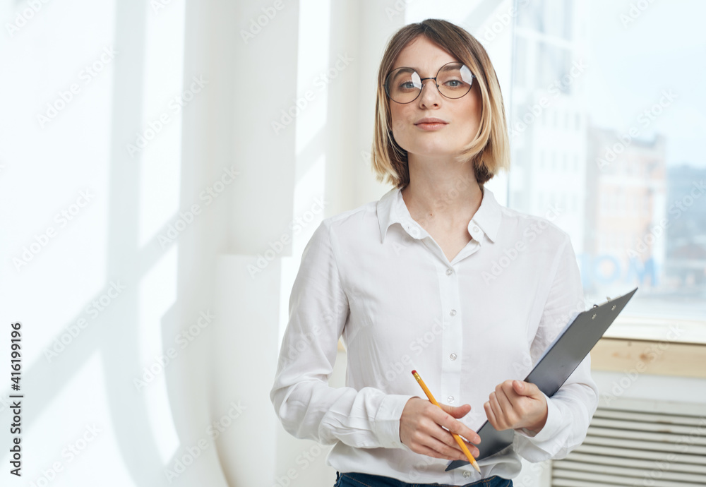 Woman business documents interior window room finance Woman business documents interior window room finance