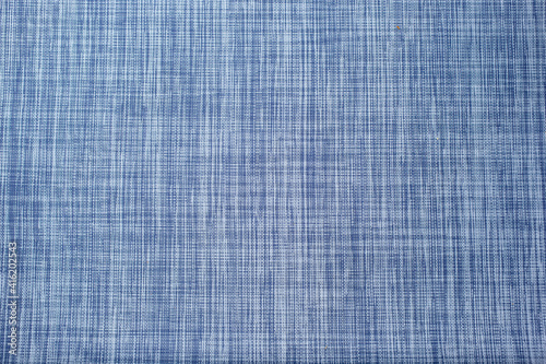 A view of a blue colored abstract criss cross woven design, as a background.