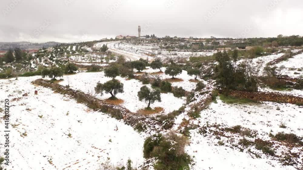 Jerusalem high hills in the snow aerial view
,drone view over mevasert zion close to Jerusalem covered with snow, February 2021
