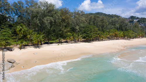 Aerial: Surin beach is a beautiful white-sand beach which is located at Phuket, Thailand