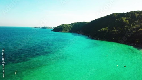 Aerial view of the sunsets over sea. Beautiful blue sea and large calm waves float on the Pacific Ocean. Ocean and sky background landscape