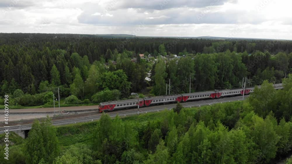 Aerial view of a moving electric train (Kirov, Russia) Aerial view of a moving electric train (Kirov, Russia)
