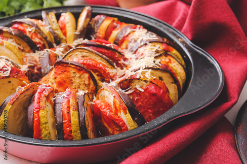 Dish of tasty baked eggplant and tomatoes, closeup