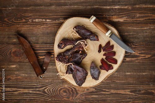 Overhead view of dried jerked deer or venison meat photo