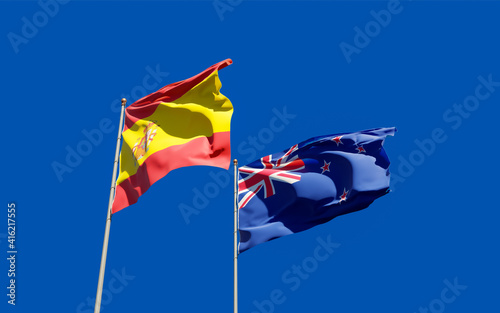 Flags of Spain and New Zealand.