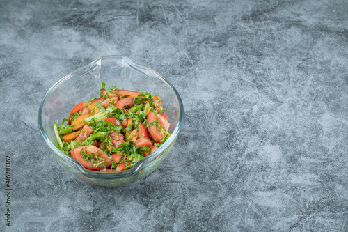 A glass plate of delicious vegetable salad