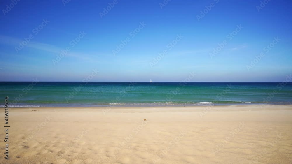Phuket beach of ocean waves crashing against an empty sand beach on paradise Empty beach deserted Phuket beach is famous tourist destination at Phuket Beautiful nature background Phuket beach of ocean waves crashing against an empty sand beach on paradise Empty beach deserted Phuket beach is famous tourist destination at Phuket Beautiful nature background