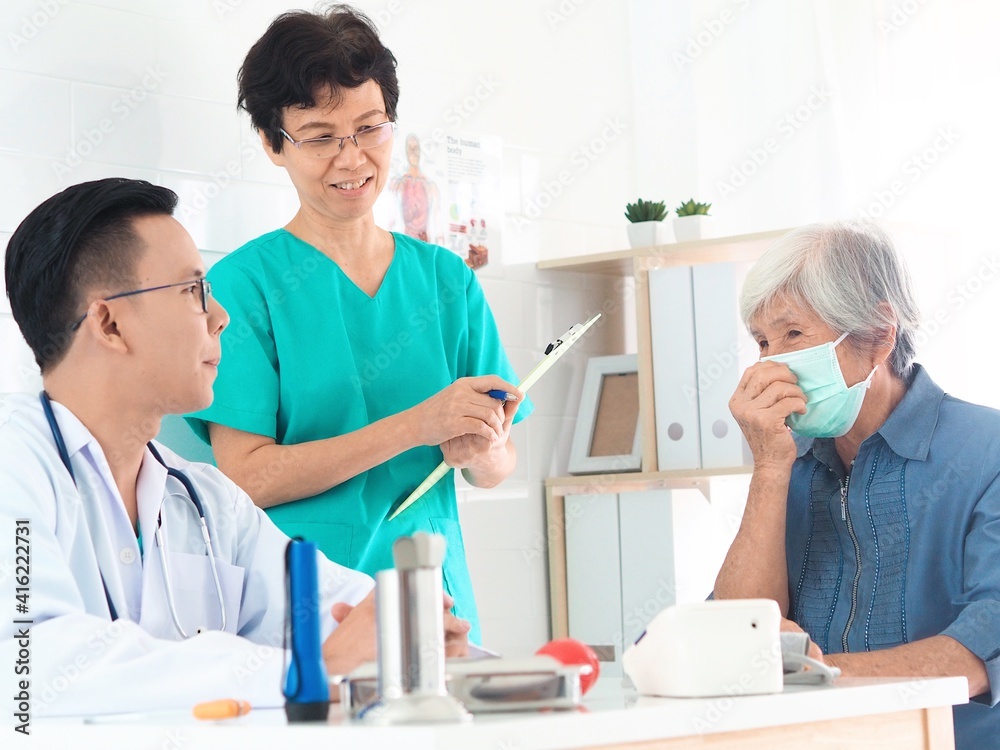 doctor and nurse examining patient doctor and nurse examining patient