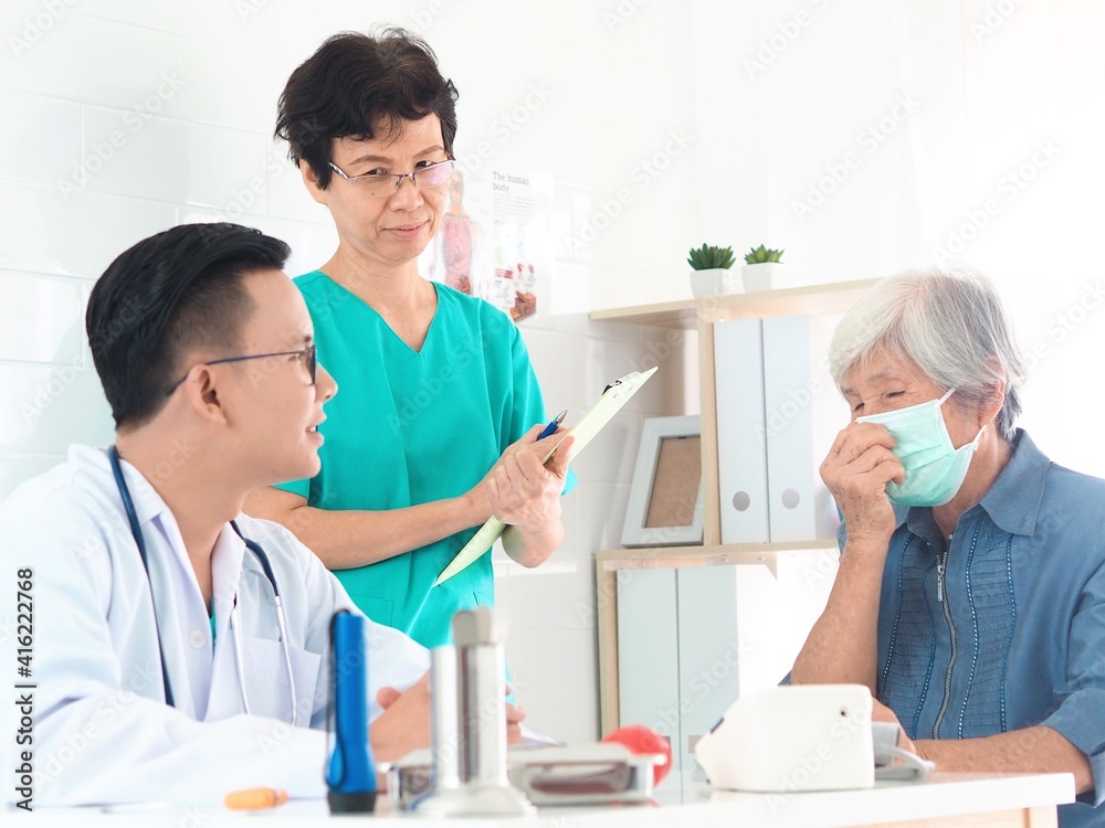 doctor and nurse examining patient doctor and nurse examining patient