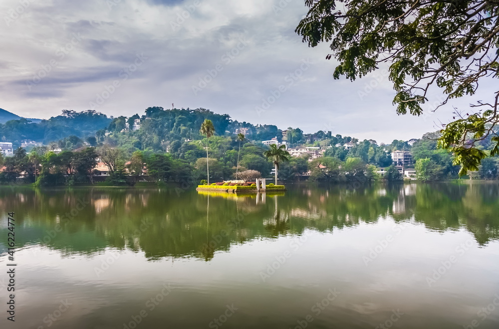 View of the city pond against the overcast sky of Kandy in Sri Lanka