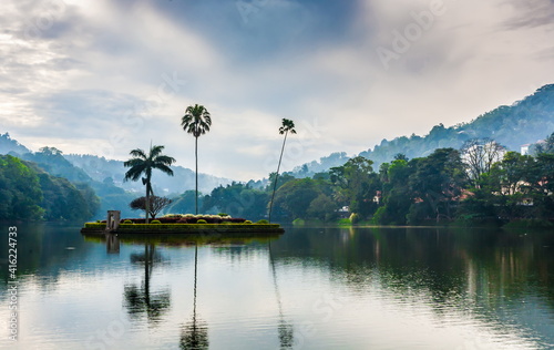 View of the city pond against the overcast sky of Kandy in Sri Lanka © Александр Коликов