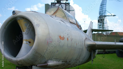 Old jet fighter aircraft in open-air military museum. Military aircrafts concept.