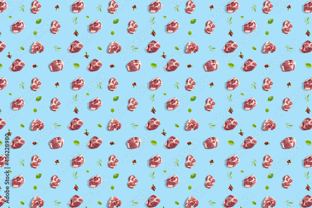 Fototapeta premium background with raw pork meat slices on blue background, raw food background, not pattern modern creative, flatlay